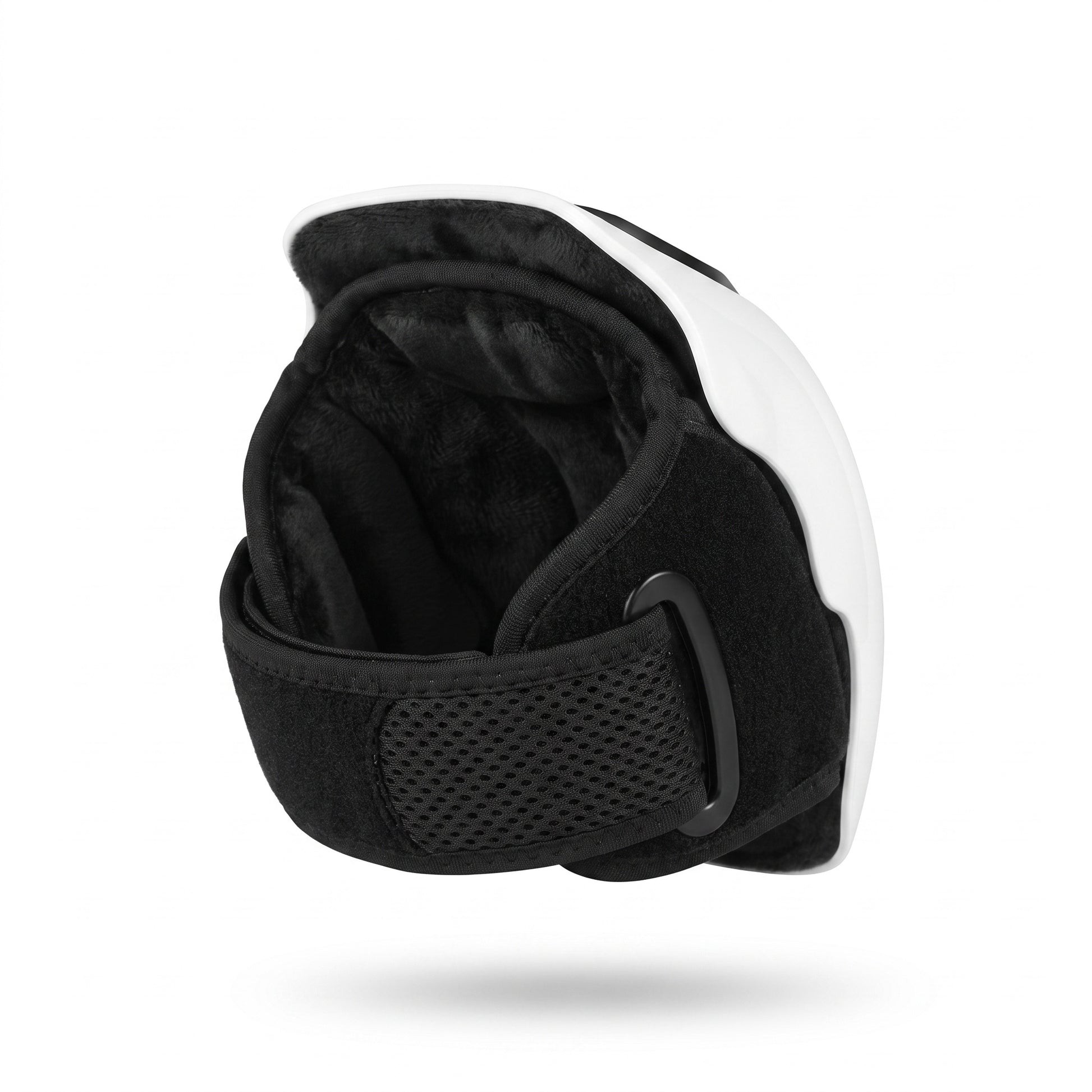 The inside of the knee massager, showing its plush lining and adjustable strap